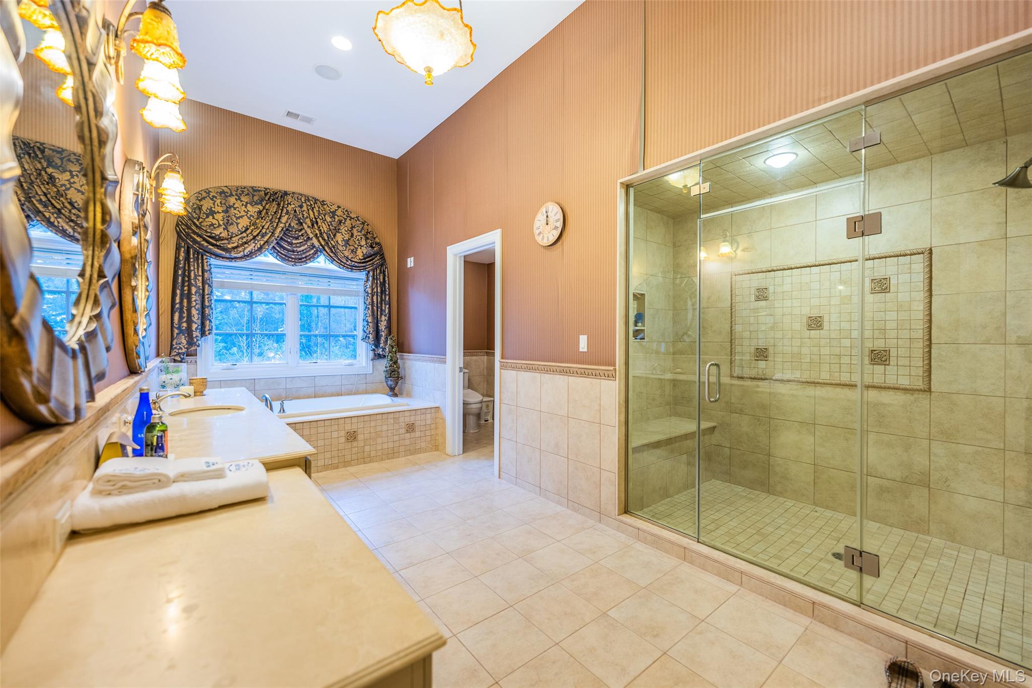 5 Westgate Road Muttontown, NY 11791 - Photo 41 of 42 a bathroom with a tub sink and mirror
