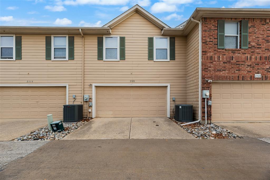 2320 Durango Ridge Drive Bedford, TX 76021 - Photo 20 of 21 a front view of a house with a yard and garage