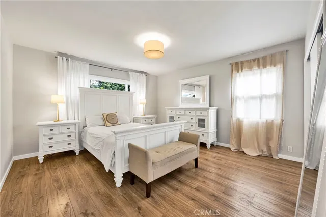 a bed room with a bed and a window