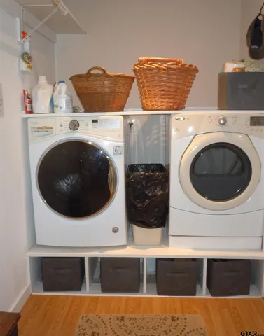 a view of a house with a tree in front of it