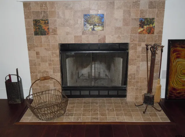 a stone house with fireplace