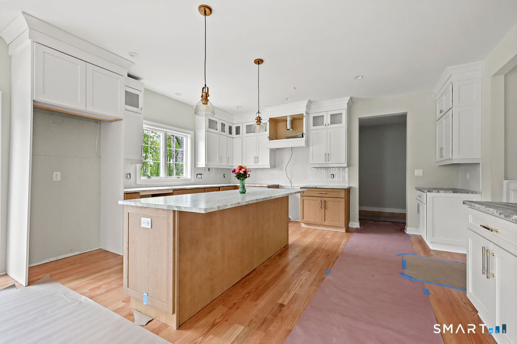 8 Ridgewood Club Road Prospect, CT 06712 - Photo 5 of 40 a kitchen with stainless steel appliances granite countertop a sink a stove and a refrigerator