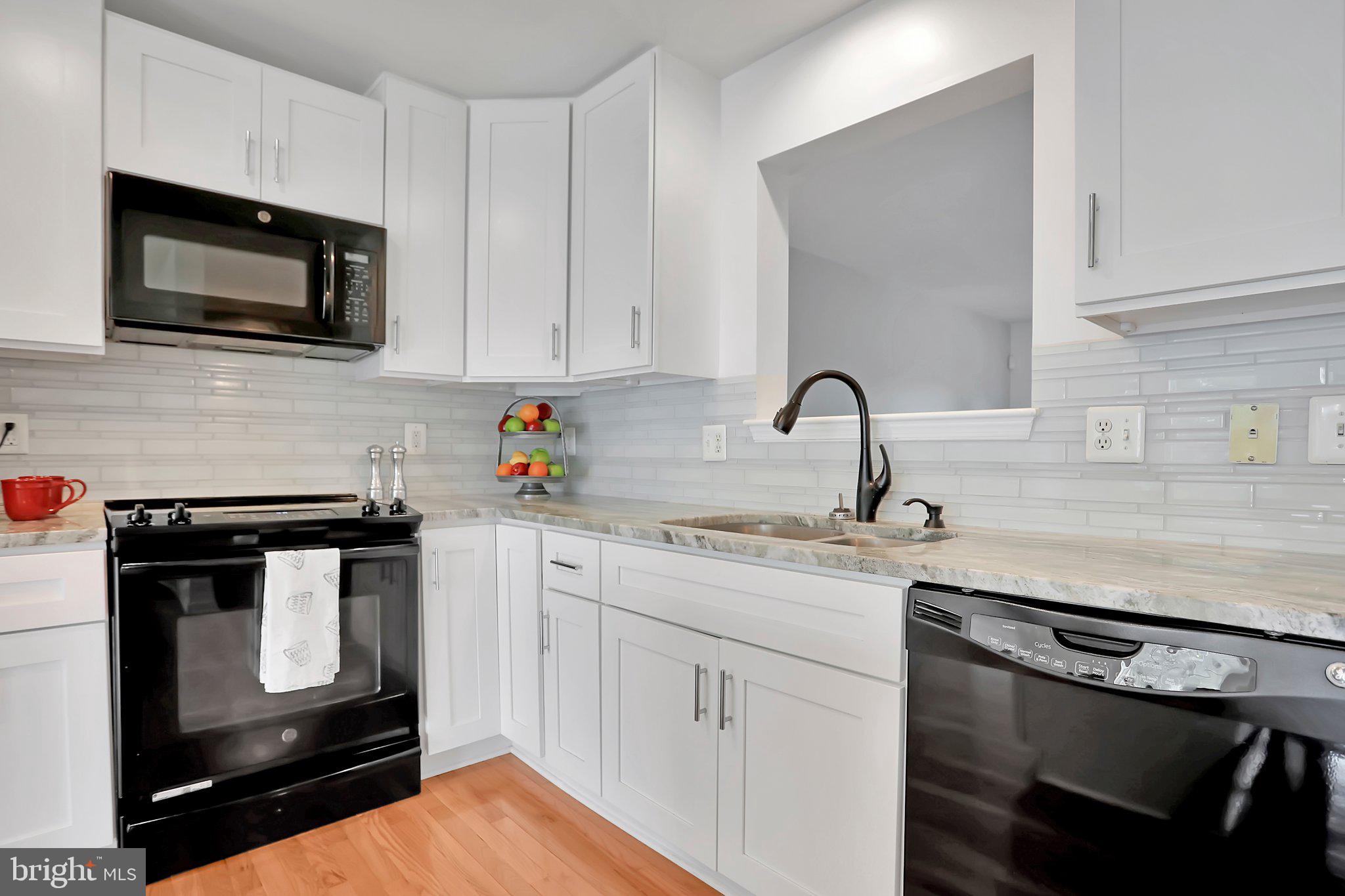 1215 Steed Street Ranson, WV 25438 - Photo 5 of 33 Custom tile backsplash, granite counter, island