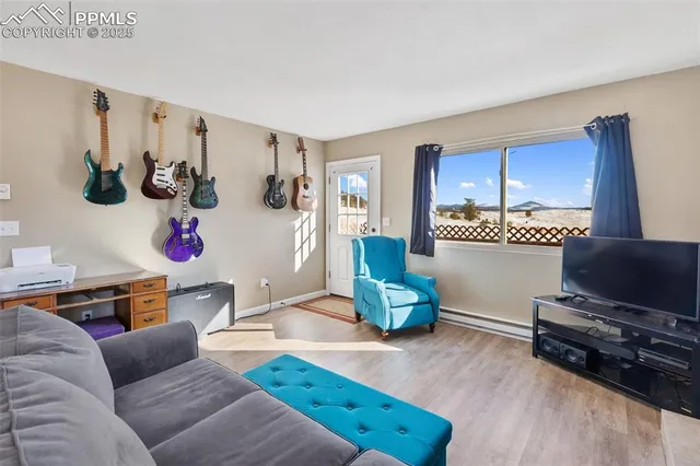 a living room with furniture and a large window
