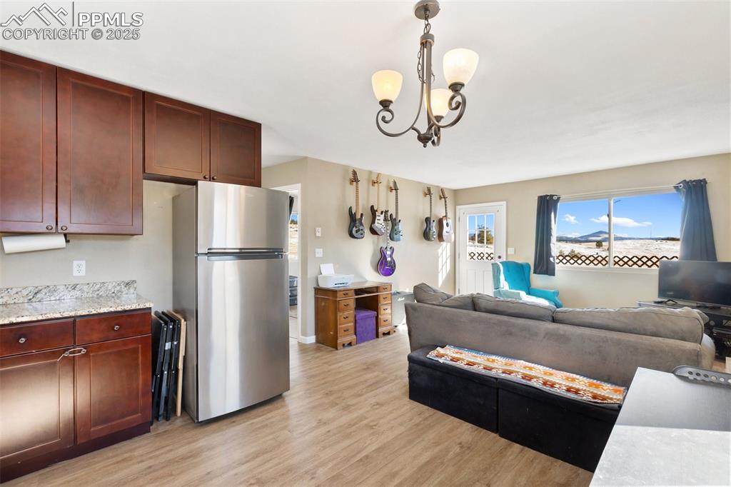 11 Valley Circle Guffey, CO 80820 - Photo 15 of 41 a living room with stainless steel appliances granite countertop furniture and a refrigerator