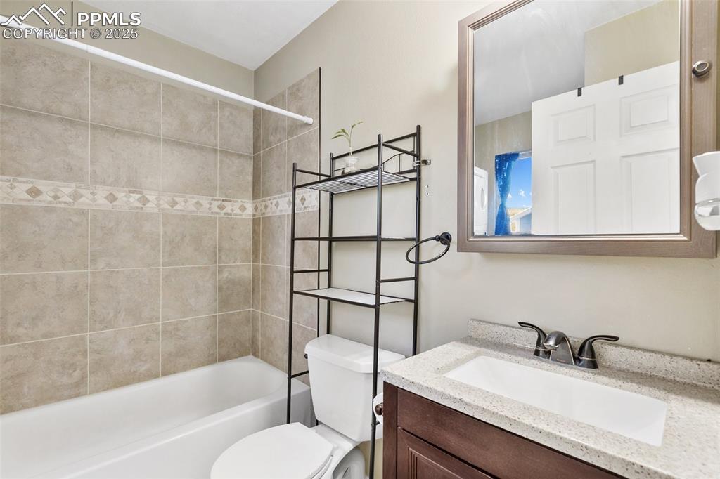 11 Valley Circle Guffey, CO 80820 - Photo 20 of 41 a bathroom with a granite countertop sink toilet and shower