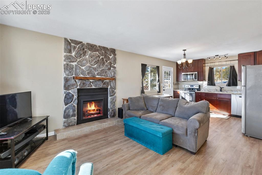 11 Valley Circle Guffey, CO 80820 - Photo 7 of 41 a living room with furniture a flat screen tv and a fireplace