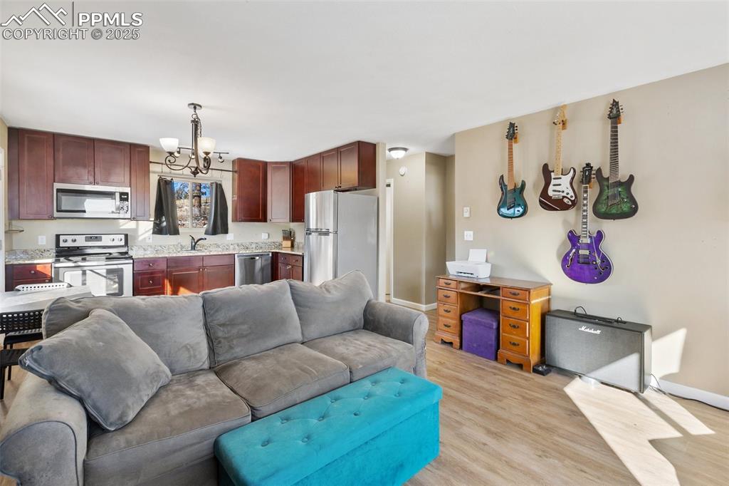 11 Valley Circle Guffey, CO 80820 - Photo 9 of 41 a living room with furniture and kitchen view