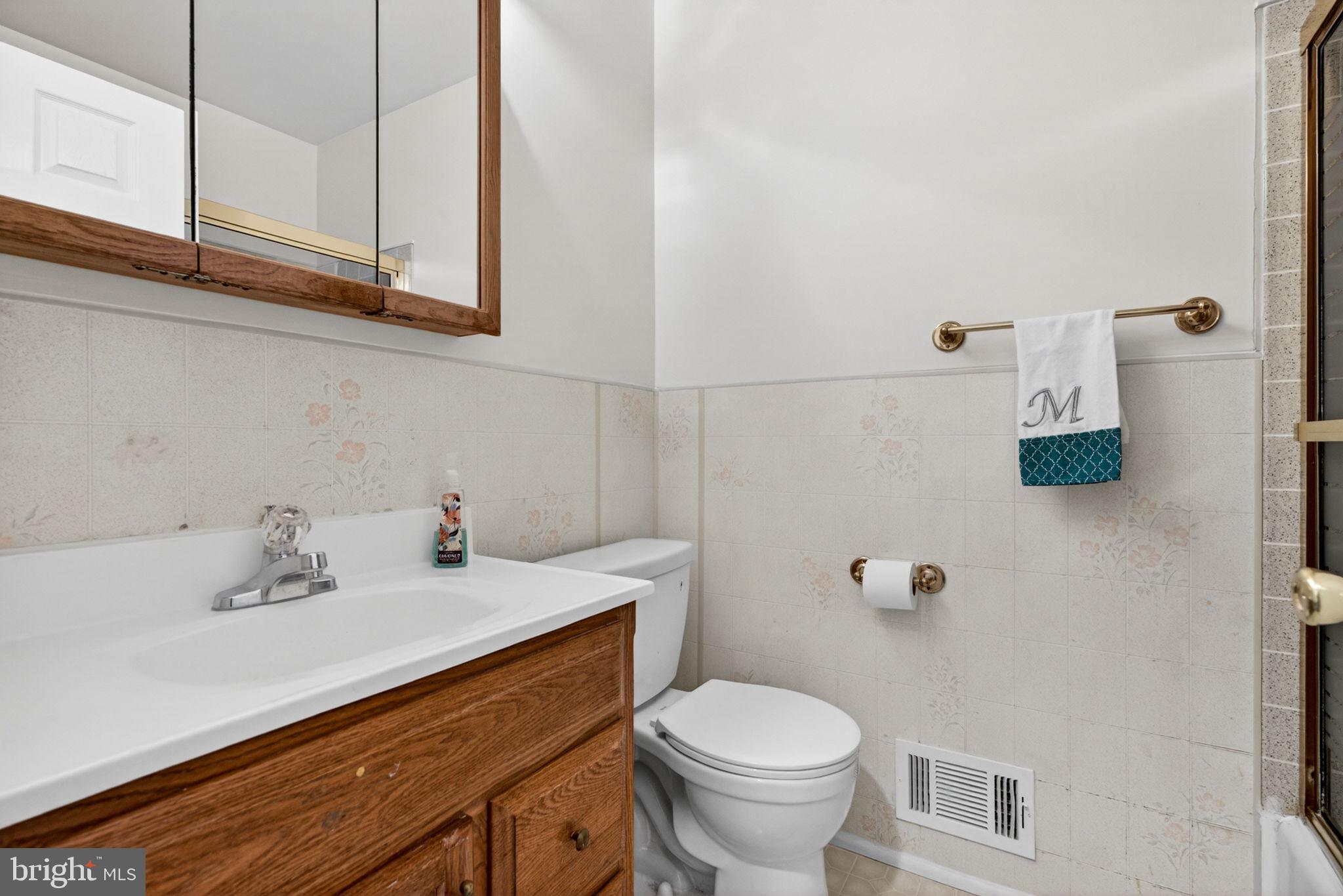 46 Trinity Avenue Marlton, NJ 08053 - Photo 18 of 37 a bathroom with a sink toilet and vanity