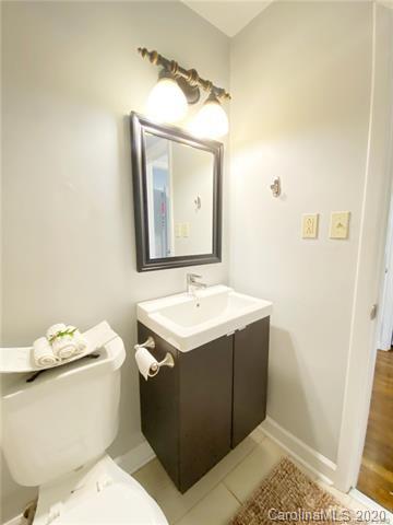 4232 Castleton Road Charlotte, NC 28211 - Photo 18 of 21 a bathroom with a sink toilet and mirror