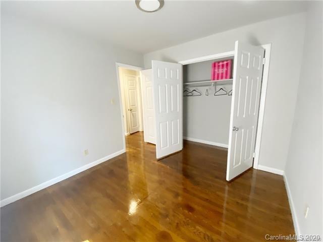 4232 Castleton Road Charlotte, NC 28211 - Photo 19 of 21 an empty room with wooden floor and windows