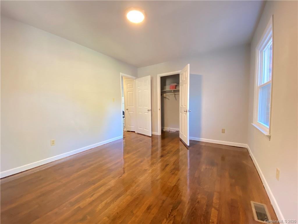 4232 Castleton Road Charlotte, NC 28211 - Photo 20 of 21 a view of an empty room with wooden floor