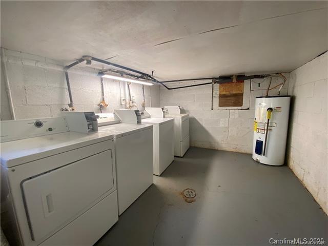 4232 Castleton Road Charlotte, NC 28211 - Photo 21 of 21 a utility room with cabinets