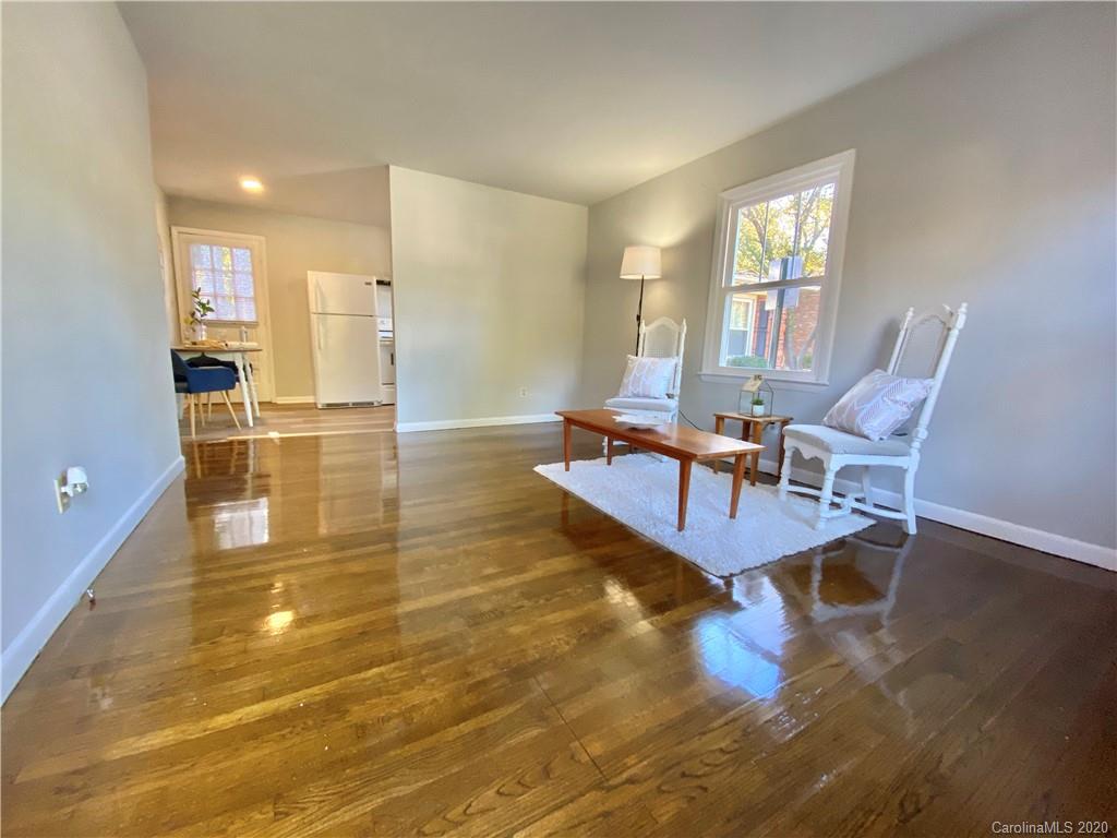 4232 Castleton Road Charlotte, NC 28211 - Photo 4 of 21 a living room with dining room and wooden floor
