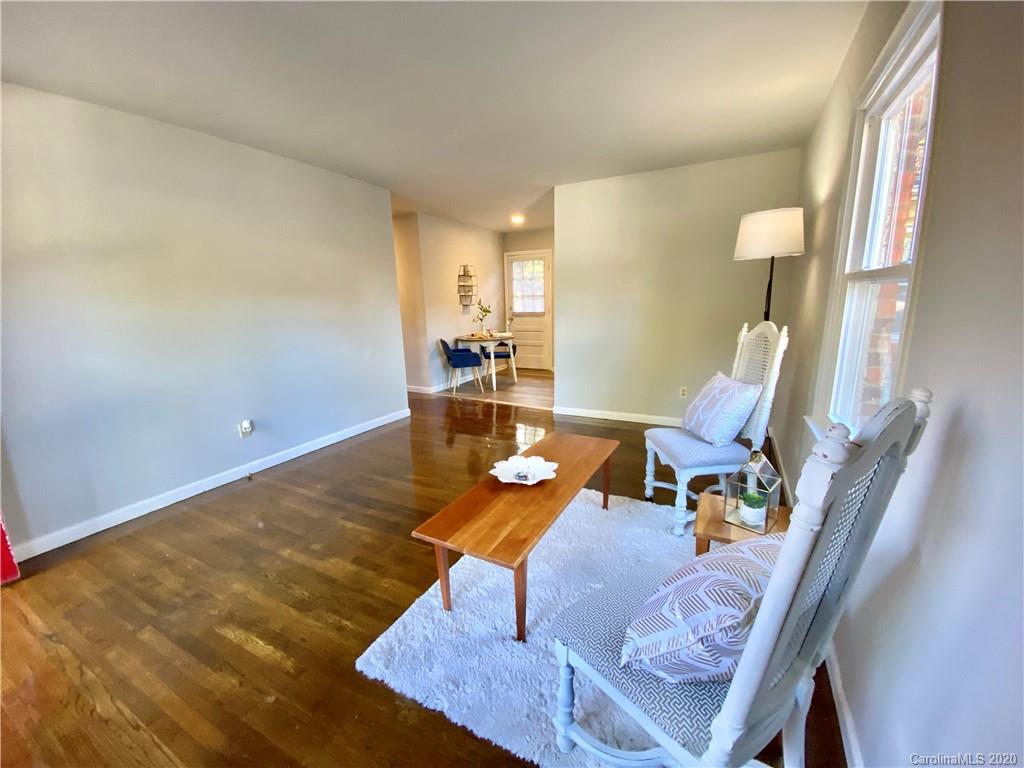 4232 Castleton Road Charlotte, NC 28211 - Photo 7 of 21 a living room with furniture and a table