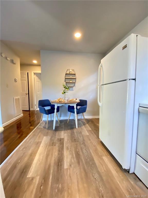 4232 Castleton Road Charlotte, NC 28211 - Photo 10 of 21 a living room with furniture and a wooden floor