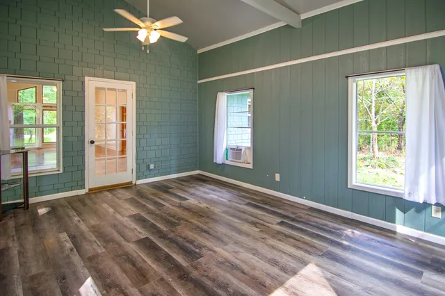 a room that has a bed and a table in it