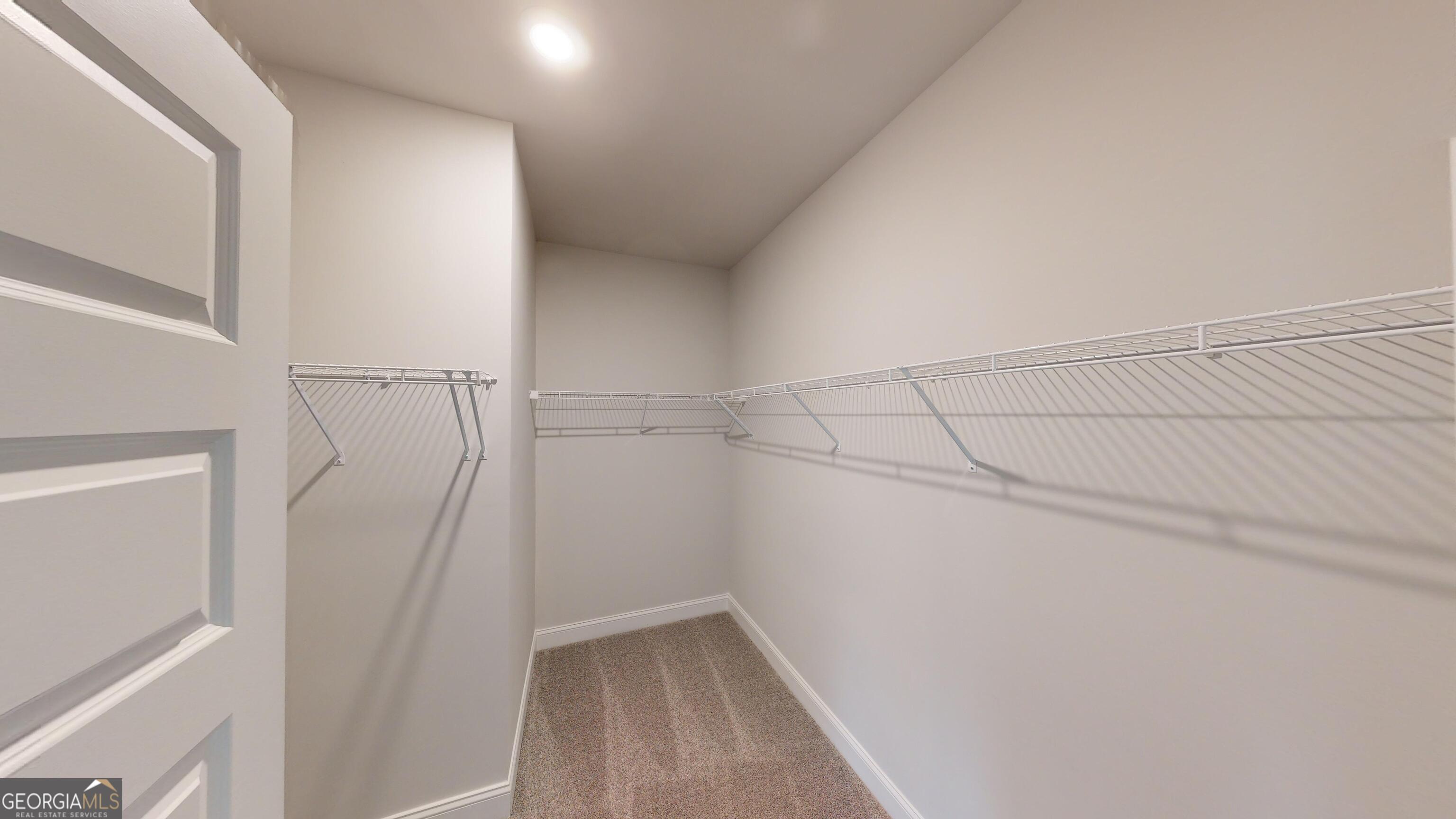 1021 Holiday Pass Griffin, GA 30223 - Photo 17 of 22 a view of a room with racks on the wall