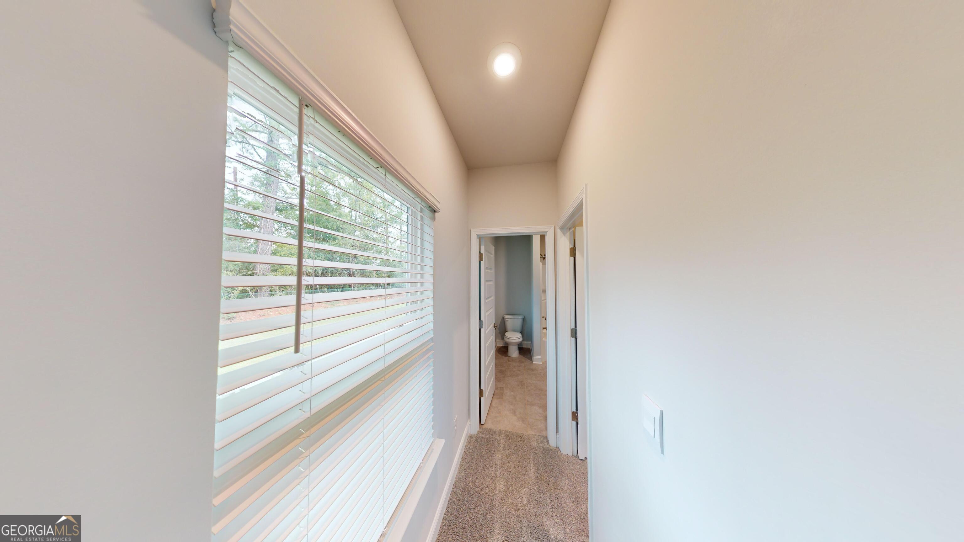 1021 Holiday Pass Griffin, GA 30223 - Photo 20 of 22 a view of hallway with windows