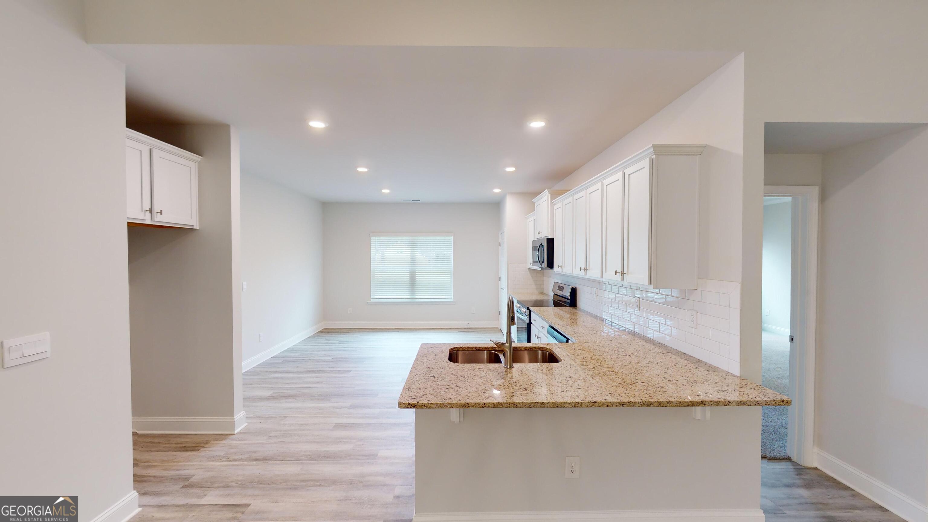1021 Holiday Pass Griffin, GA 30223 - Photo 5 of 22 a kitchen with sink and window