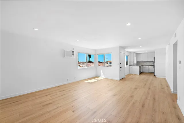a view of a kitchen with a sink and cabinets