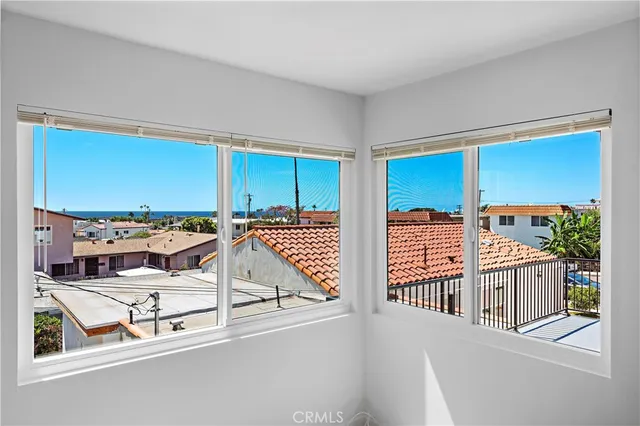 a view of a living room and balcony