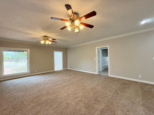 1001 North 3rd Street Lamesa, TX 79331 - Photo 21 of 32 a view of an empty room with a ceiling fan