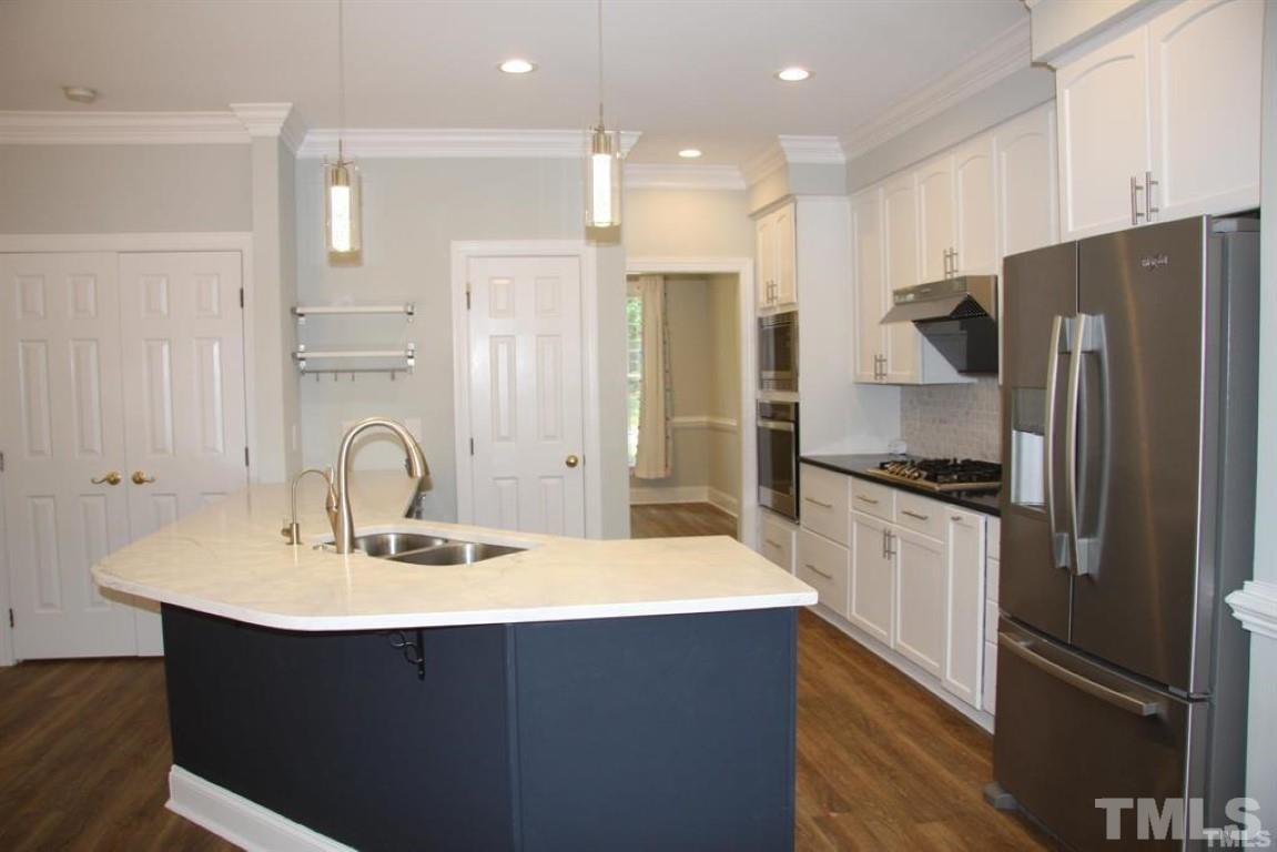 204 Morrow Mountain Drive Cary, NC 27513 - Photo 11 of 40 a kitchen with refrigerator a sink and a refrigerator