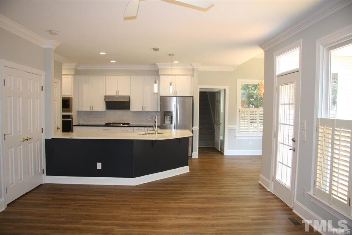 204 Morrow Mountain Drive Cary, NC 27513 - Photo 12 of 40 a view of kitchen with stainless steel appliances granite countertop a stove and a refrigerator