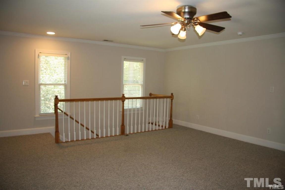 204 Morrow Mountain Drive Cary, NC 27513 - Photo 19 of 40 an empty room with windows and fan