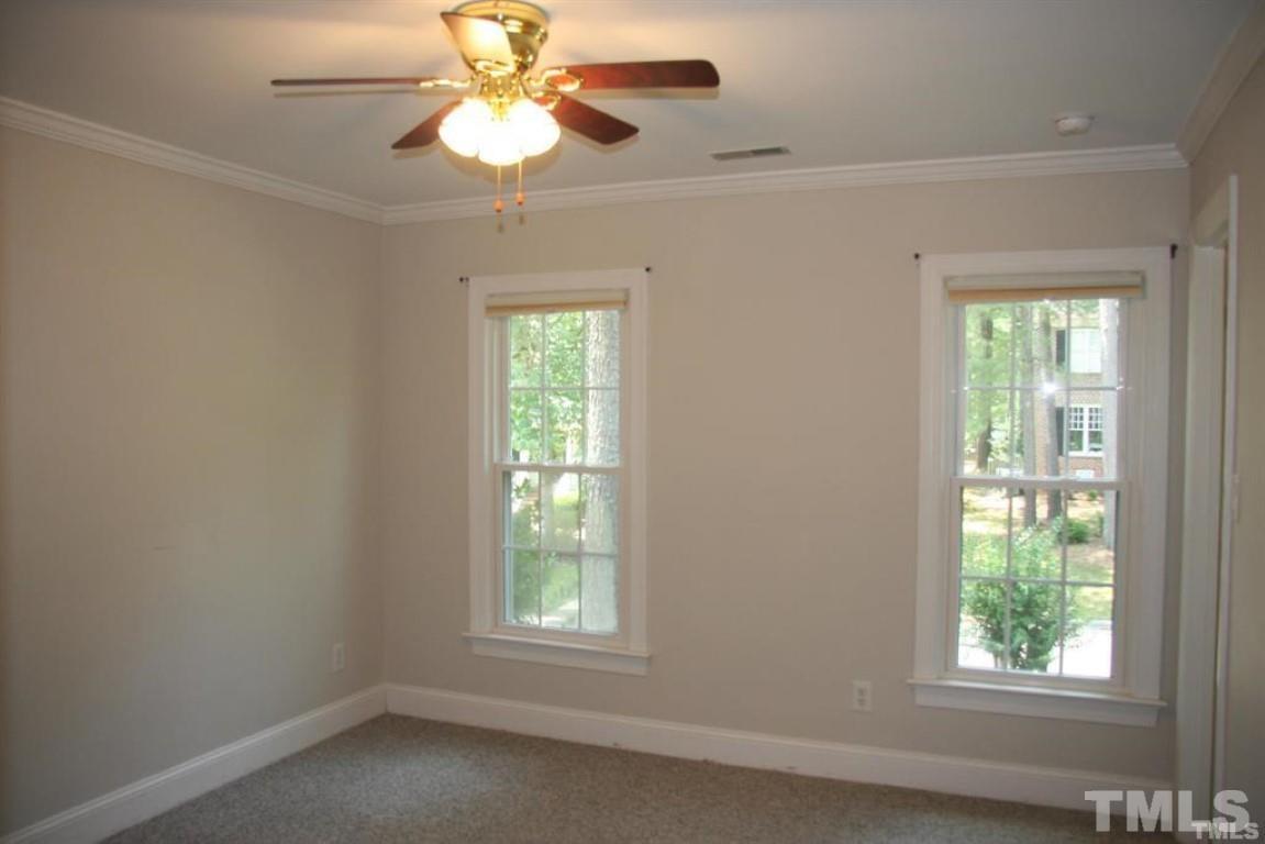 204 Morrow Mountain Drive Cary, NC 27513 - Photo 32 of 40 an empty room with a window and a fan