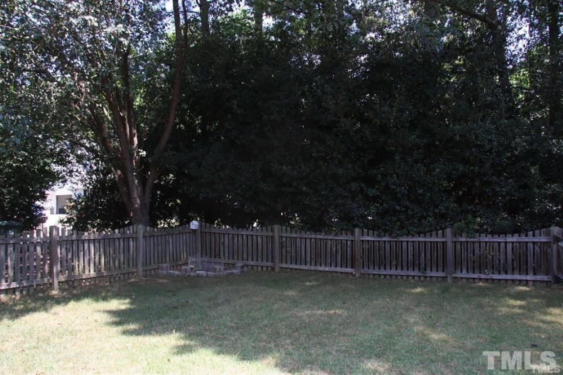 204 Morrow Mountain Drive Cary, NC 27513 - Photo 40 of 40 a view of a yard with wooden fence