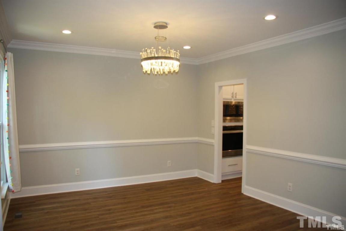 204 Morrow Mountain Drive Cary, NC 27513 - Photo 6 of 40 wooden floor in an empty room with a window