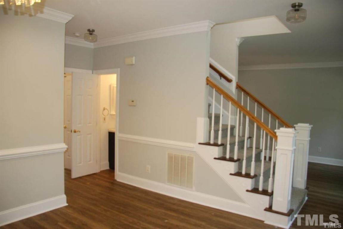 204 Morrow Mountain Drive Cary, NC 27513 - Photo 7 of 40 a view of entryway with wooden floor and stairs