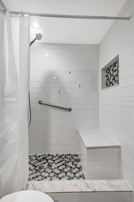 10199 Elgin Boulevard Spring Hill, FL 34608 - Photo 17 of 66 a bathroom with a shower