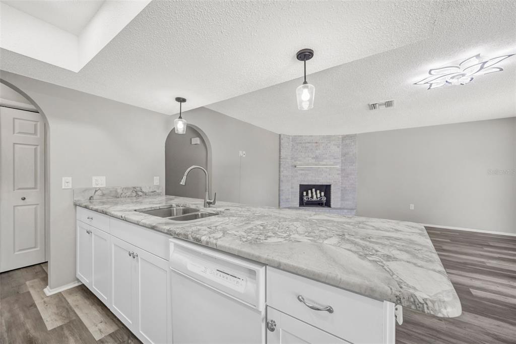 10199 Elgin Boulevard Spring Hill, FL 34608 - Photo 22 of 66 a spacious bathroom with a granite countertop sink and a mirror