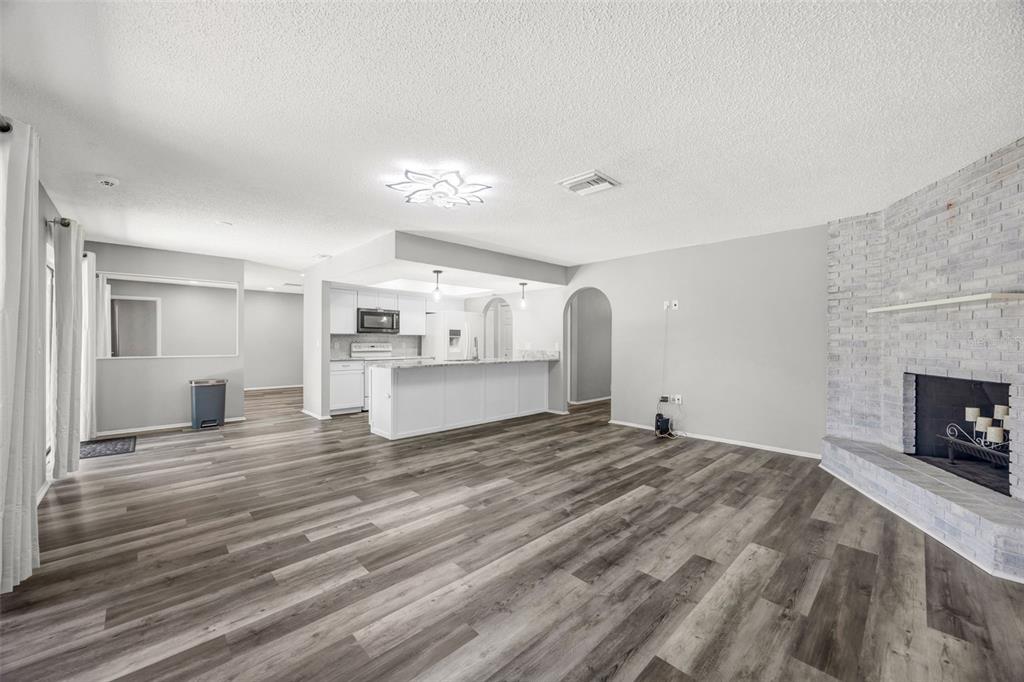 10199 Elgin Boulevard Spring Hill, FL 34608 - Photo 28 of 66 a view of a livingroom with a fireplace