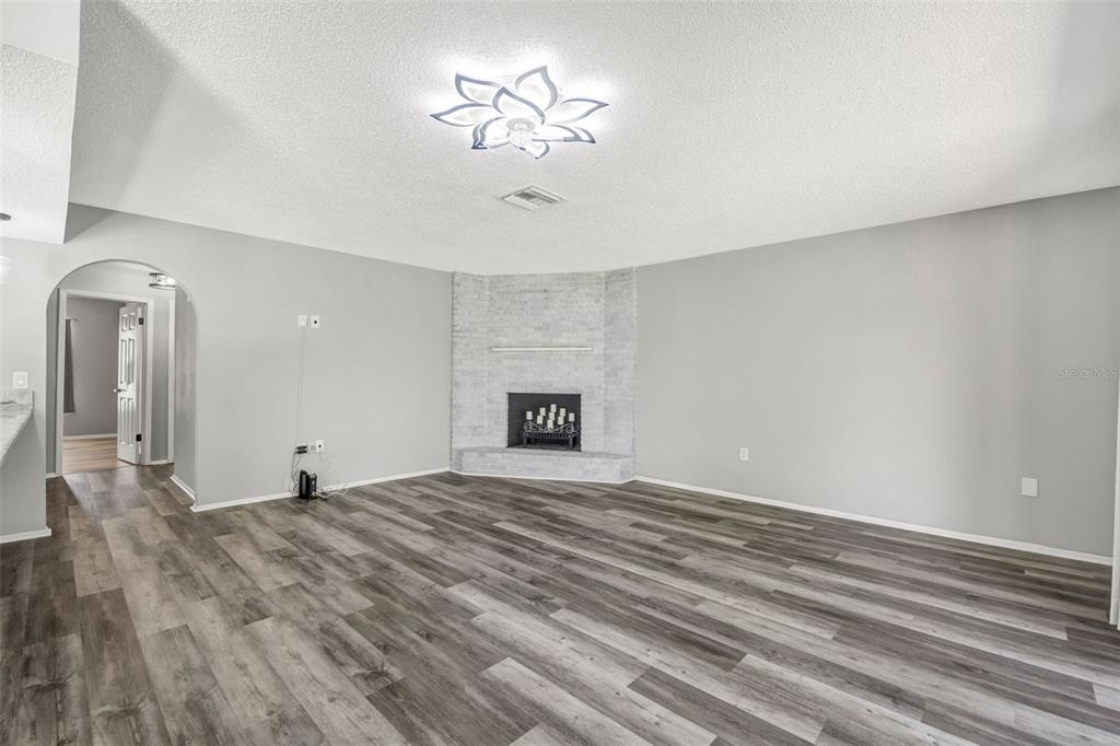 10199 Elgin Boulevard Spring Hill, FL 34608 - Photo 29 of 66 a view of empty room with a fireplace