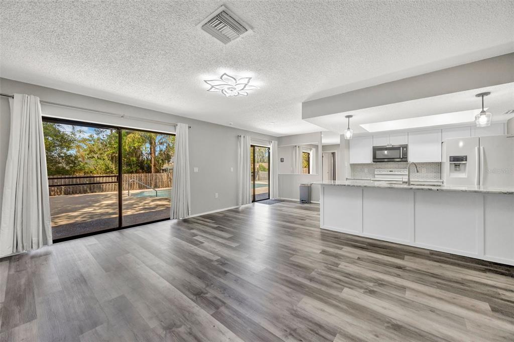 10199 Elgin Boulevard Spring Hill, FL 34608 - Photo 34 of 66 a view of a kitchen with wooden floor and a window