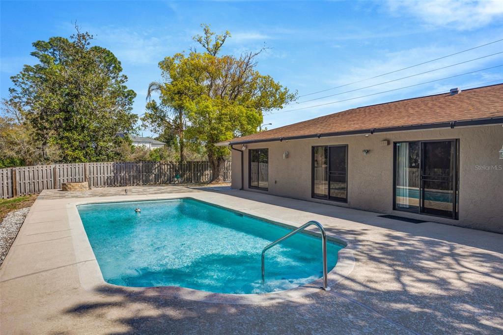 10199 Elgin Boulevard Spring Hill, FL 34608 - Photo 42 of 66 a view of a house with backyard and sitting area