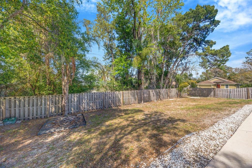 10199 Elgin Boulevard Spring Hill, FL 34608 - Photo 51 of 66 a view of backyard of a house with wooden fence
