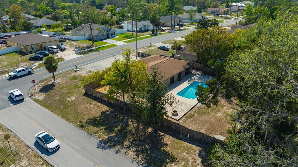 10199 Elgin Boulevard Spring Hill, FL 34608 - Photo 57 of 66 an aerial view of residential houses with outdoor space