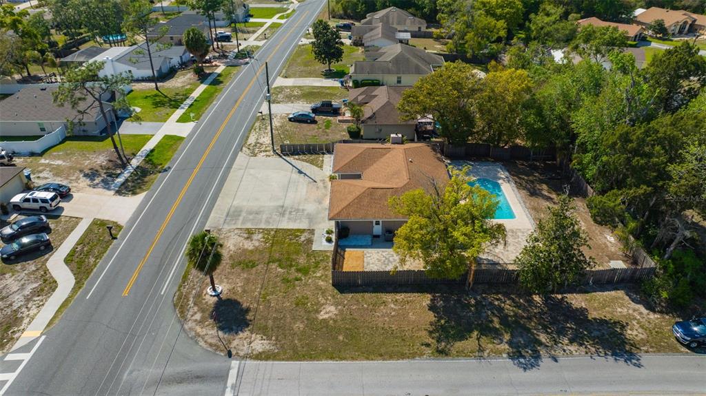 10199 Elgin Boulevard Spring Hill, FL 34608 - Photo 58 of 66 an aerial view of residential houses with outdoor space