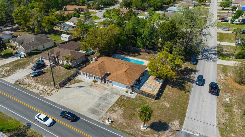 10199 Elgin Boulevard Spring Hill, FL 34608 - Photo 59 of 66 an aerial view of a residential houses with yard