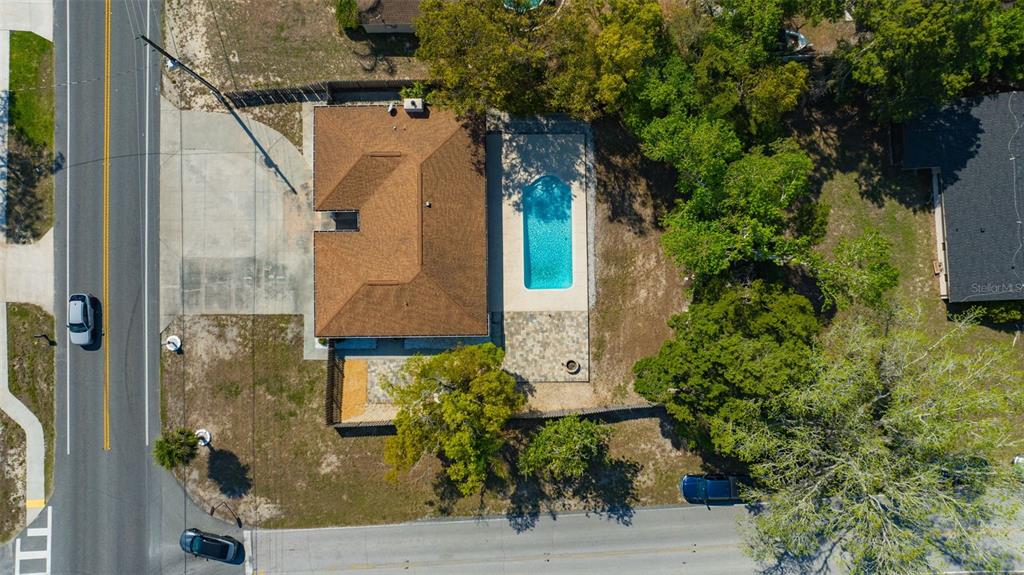 10199 Elgin Boulevard Spring Hill, FL 34608 - Photo 65 of 66 an aerial view of a house with a yard