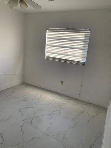 a view of empty room with a window