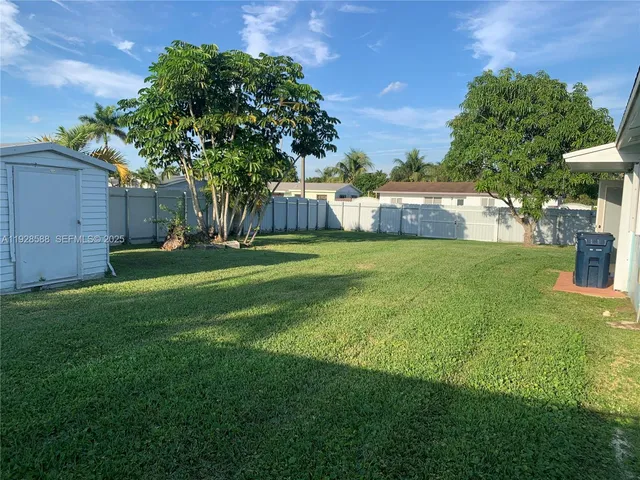 a view of a backyard with a garden