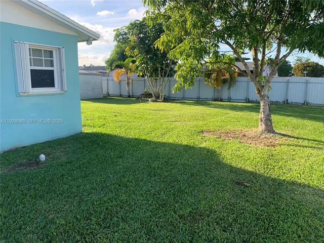 a view of a house with a park