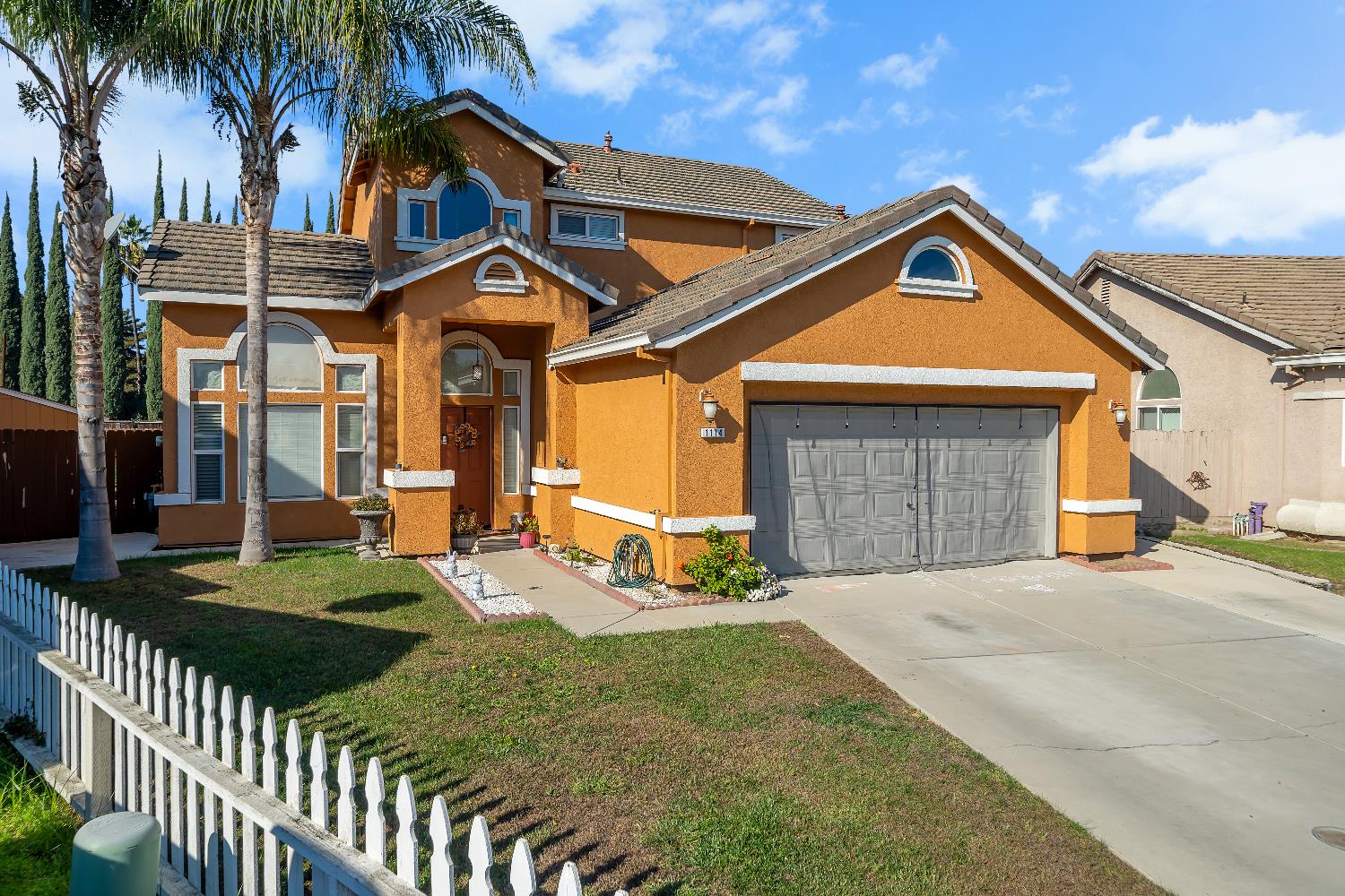 1114 Kay Circle Turlock, CA 95382 - Photo 2 of 40 a front view of a house with garden