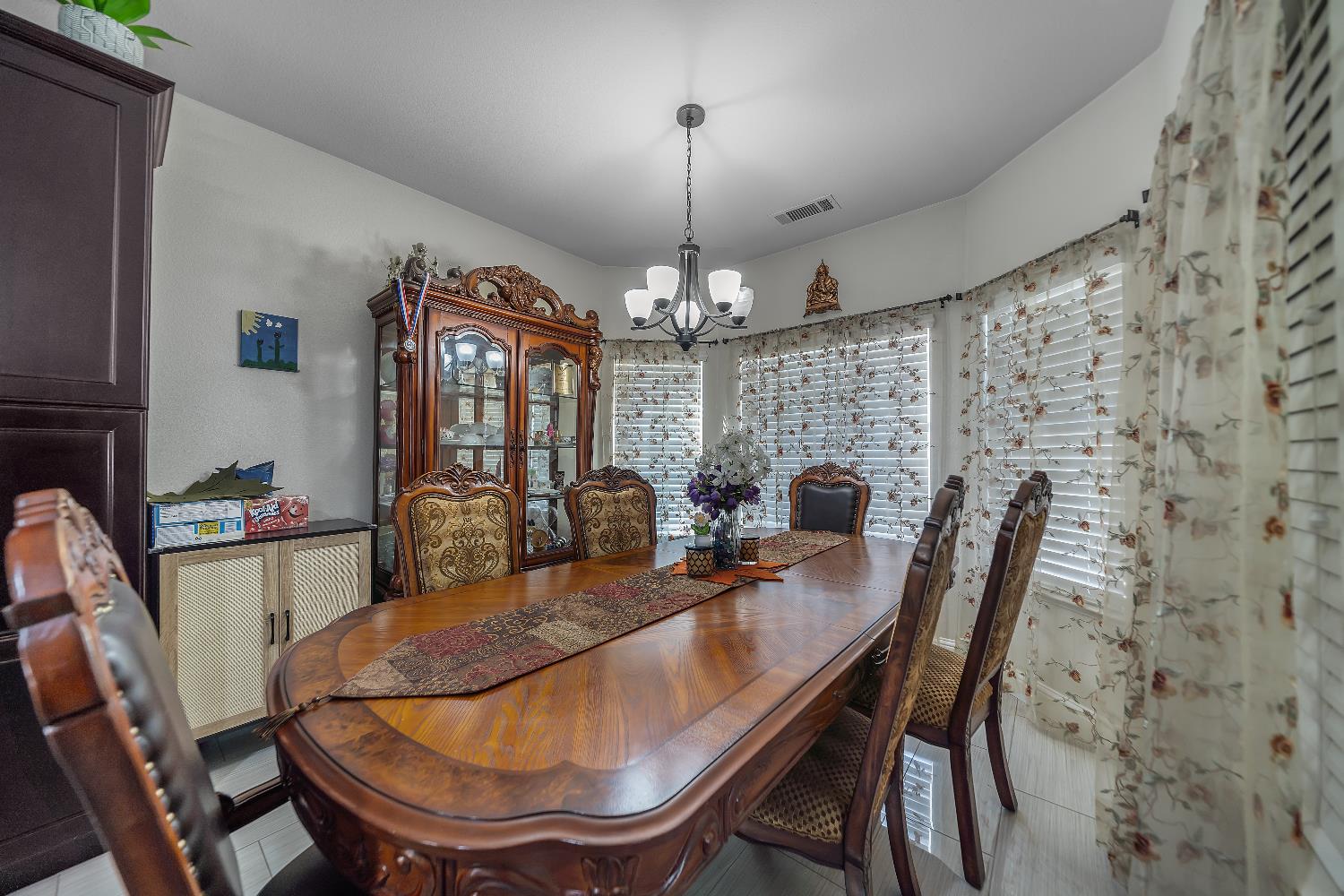 1114 Kay Circle Turlock, CA 95382 - Photo 23 of 40 a view of a dining room with furniture window and outside view